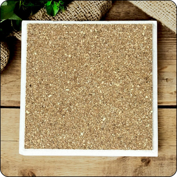 Ceramic coaster with a cork backing, designed to protect surfaces and prevent slipping