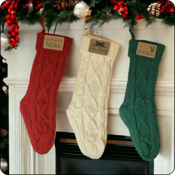 Custom engraved Christmas stockings hanging on a fireplace mantle, available in Christmas lights, cat, and pawprint with antlers designs