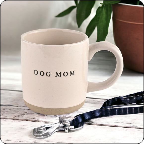 Dog Mom stoneware mug placed near a dog leash, perfect for pet lovers and coffee time