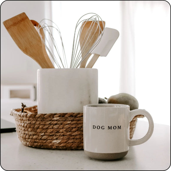 Dog Mom stoneware mug on a modern kitchen counter with utensils, perfect for stylish home decor