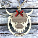 Layered wood Highland Cow Christmas ornament with 'Mooooey Christmas' engraving