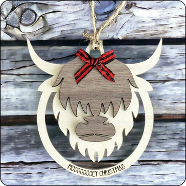 Layered wood Highland Cow Christmas ornament with 'Mooooey Christmas' engraving