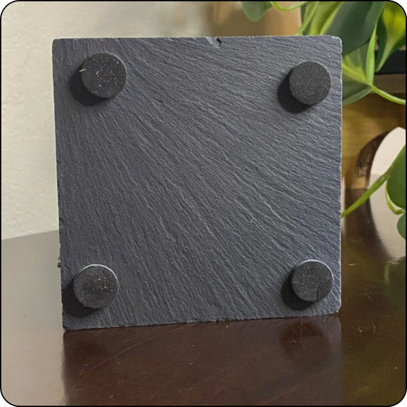 Back of slate coaster with protective pads to prevent scratches on surfaces