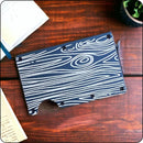 Minimalist wallet with laser-engraved woodgrain texture for a rustic look